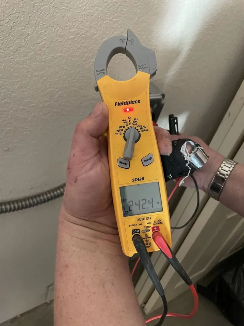 Voltage testing with clamp meter during Outlet Installation in Billerica